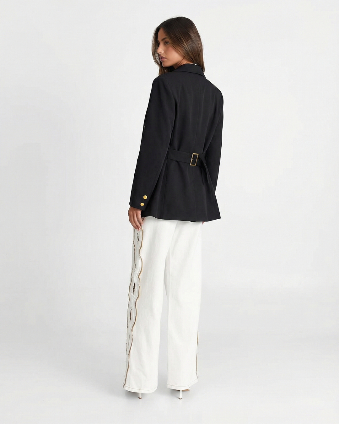 Chic women's tailored blazer with gleaming gold buttons, a versatile piece for professional or elegant everyday wear.