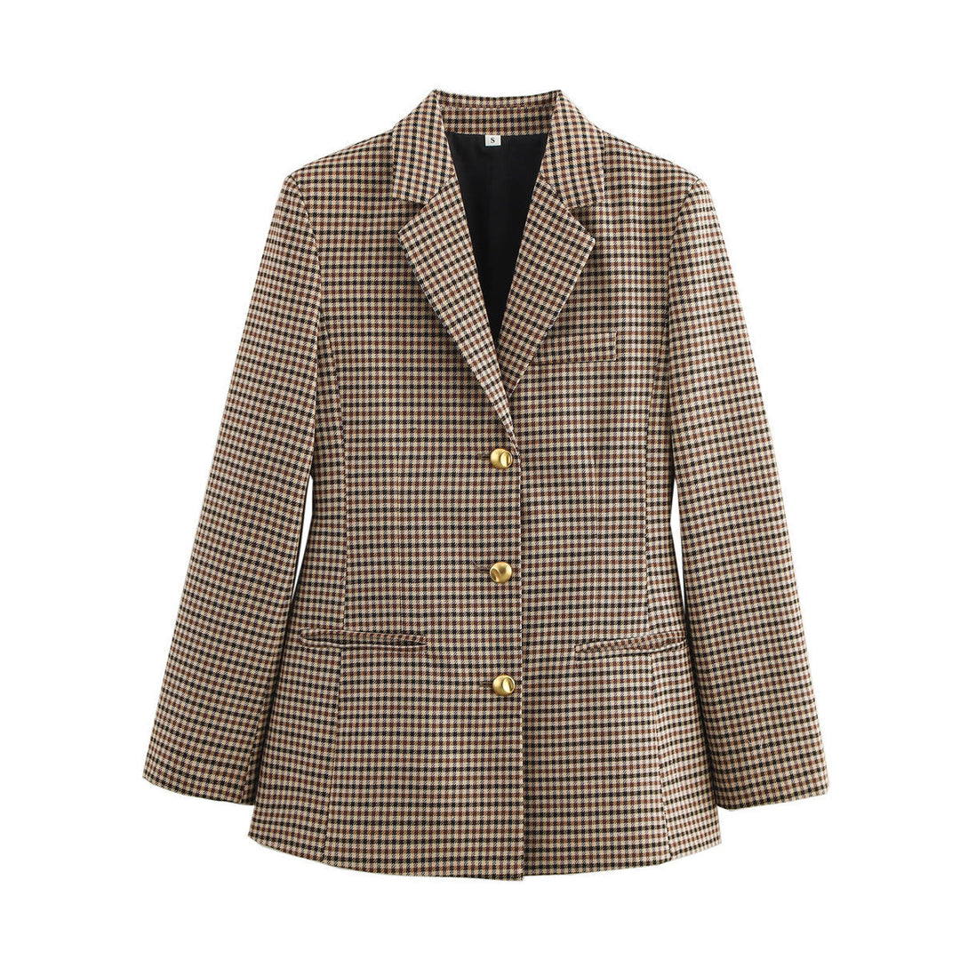 Refined women's tailored blazer featuring sophisticated gold buttons, enhancing any elegant or professional outfit.