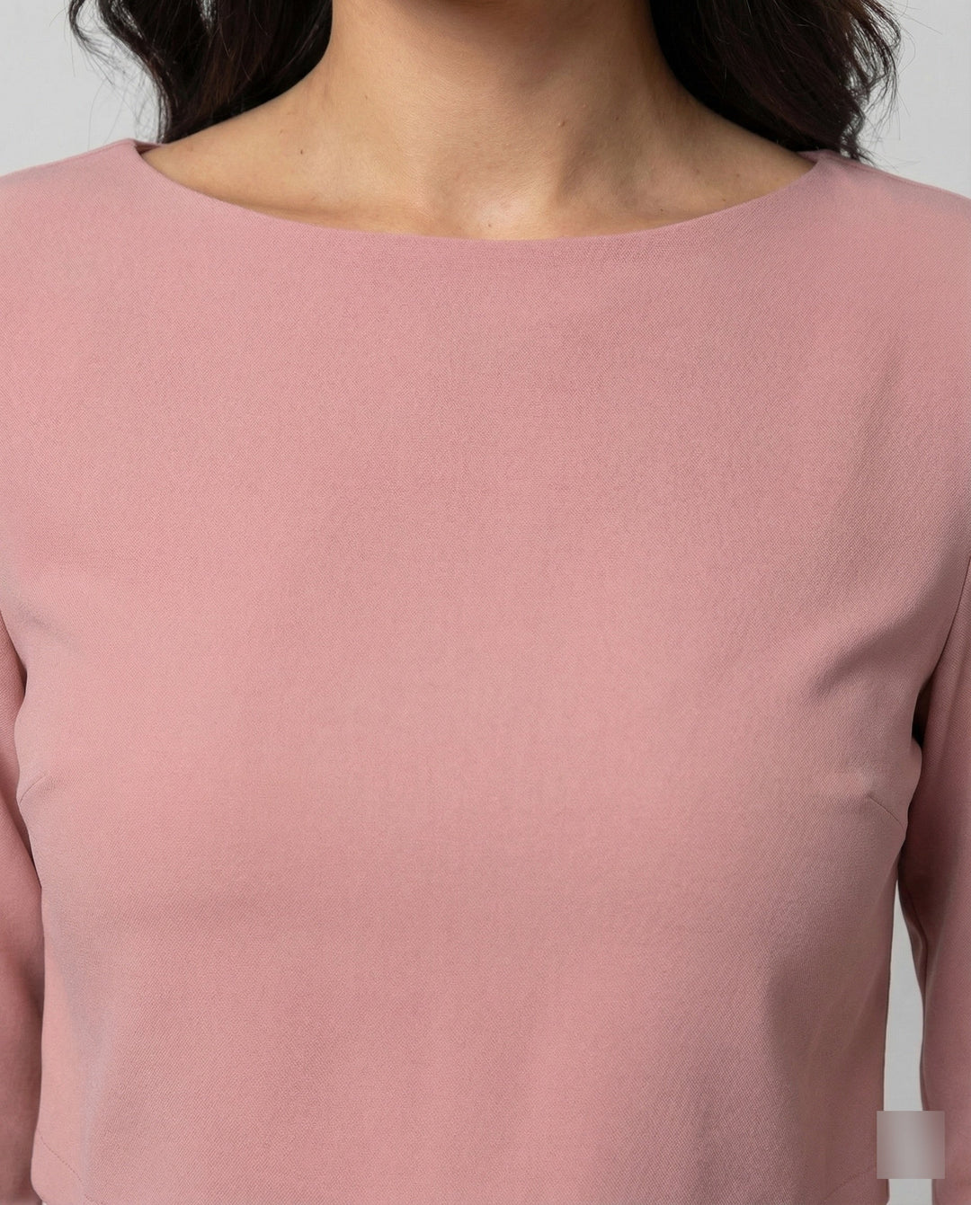 Chic two-piece outfit featuring tailored trousers and a matching cropped top.