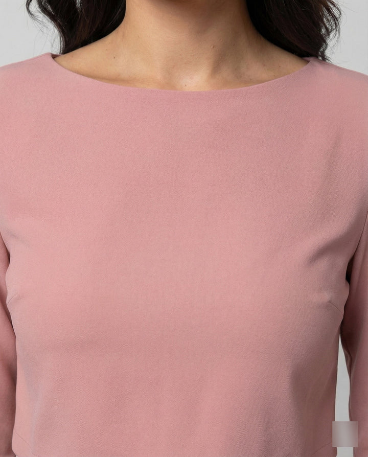 Chic two-piece outfit featuring tailored trousers and a matching cropped top.