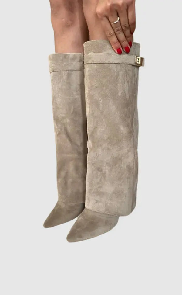 Women's elegant tall leather boots with refined silhouette for stylish comfort.