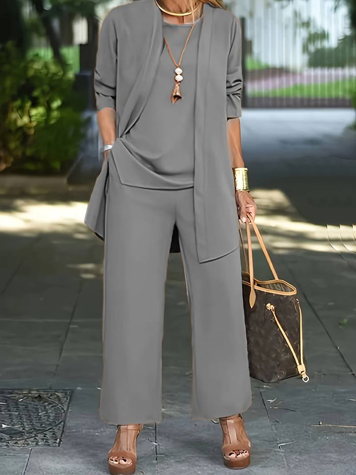 Sophisticated ladies apparel: stylish women's suit with matching blazer, top, and pants