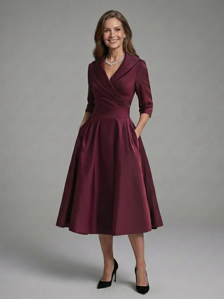 White three-quarter sleeve wrap midi dress, a sophisticated and versatile choice for formal elegance.