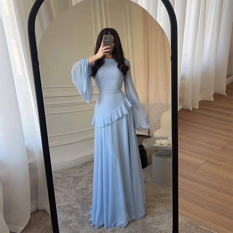 Long tiered formal dress for women, featuring chic bell sleeves, ideal for wedding guest attire.