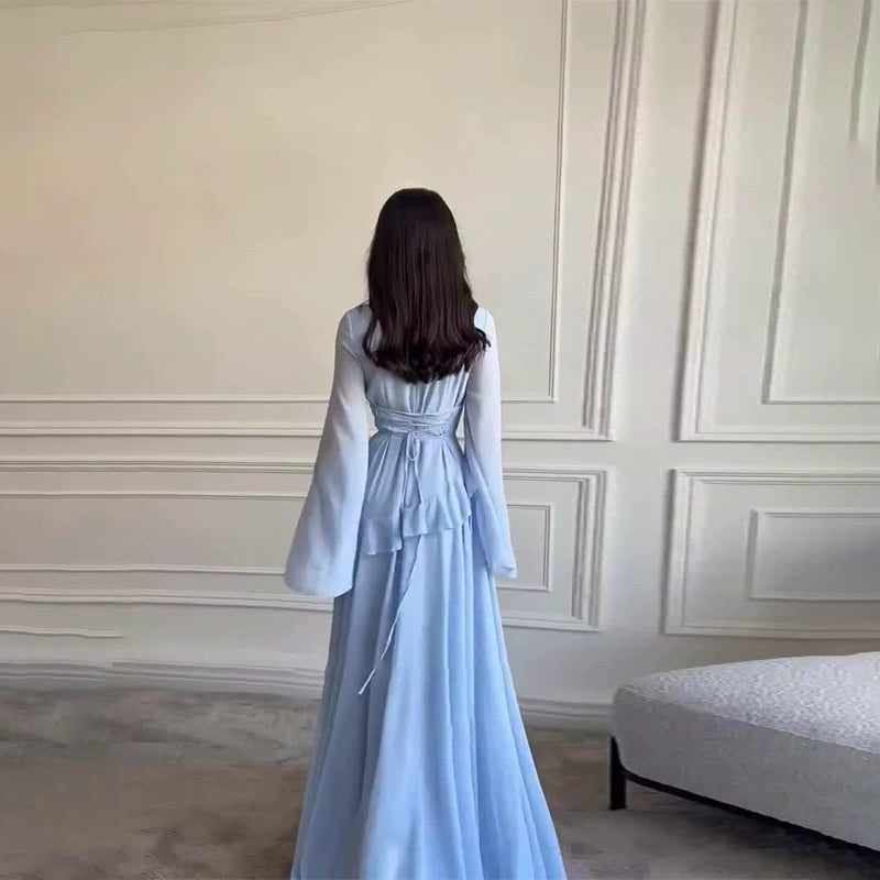 Wedding guest maxi dress for women, elegant tiered design with stylish bell sleeves, special occasion wear.