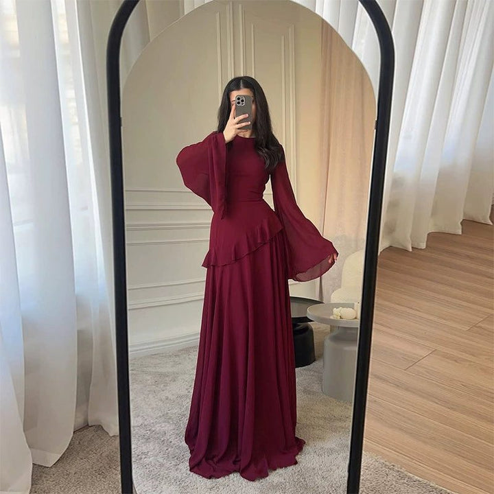 Elegant women's long tiered dress with flowing bell sleeves, ideal for wedding guests & formal occasions.