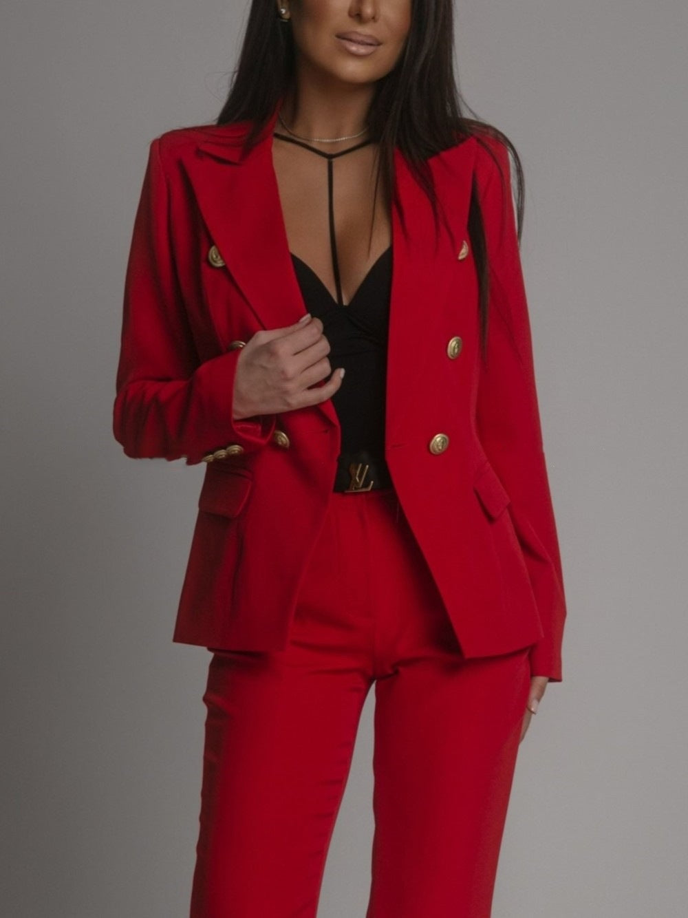 Stylish women's business attire: sophisticated blazer and trousers set, perfect for work.