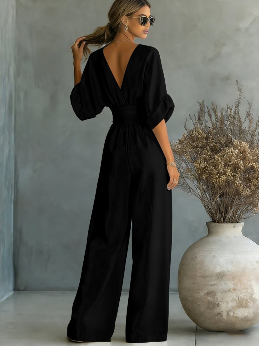 Stunning women's V-neck jumpsuit, perfect for elegant evening wear. Flattering one-piece for special events.