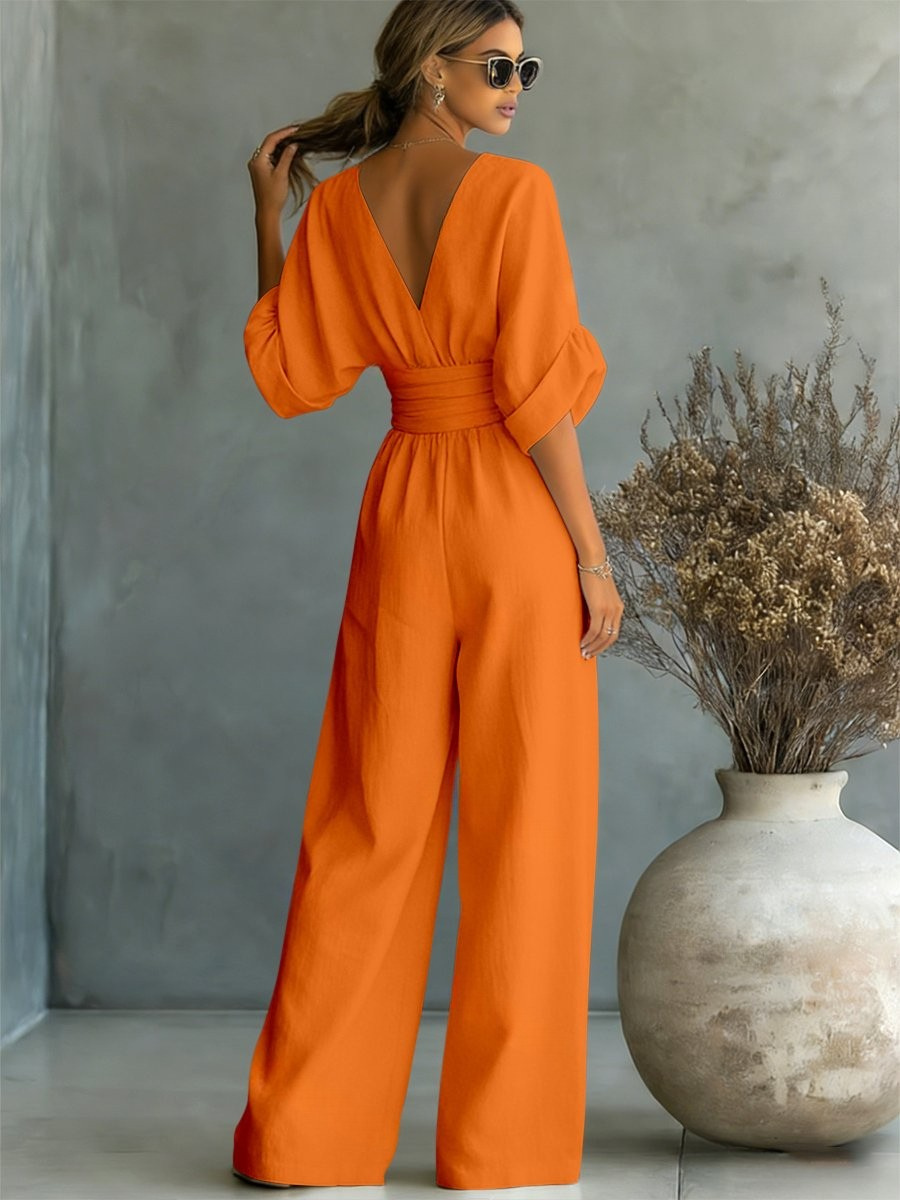 Women's elegant V-neck jumpsuit. Versatile one-piece for comfortable day to evening fashion.