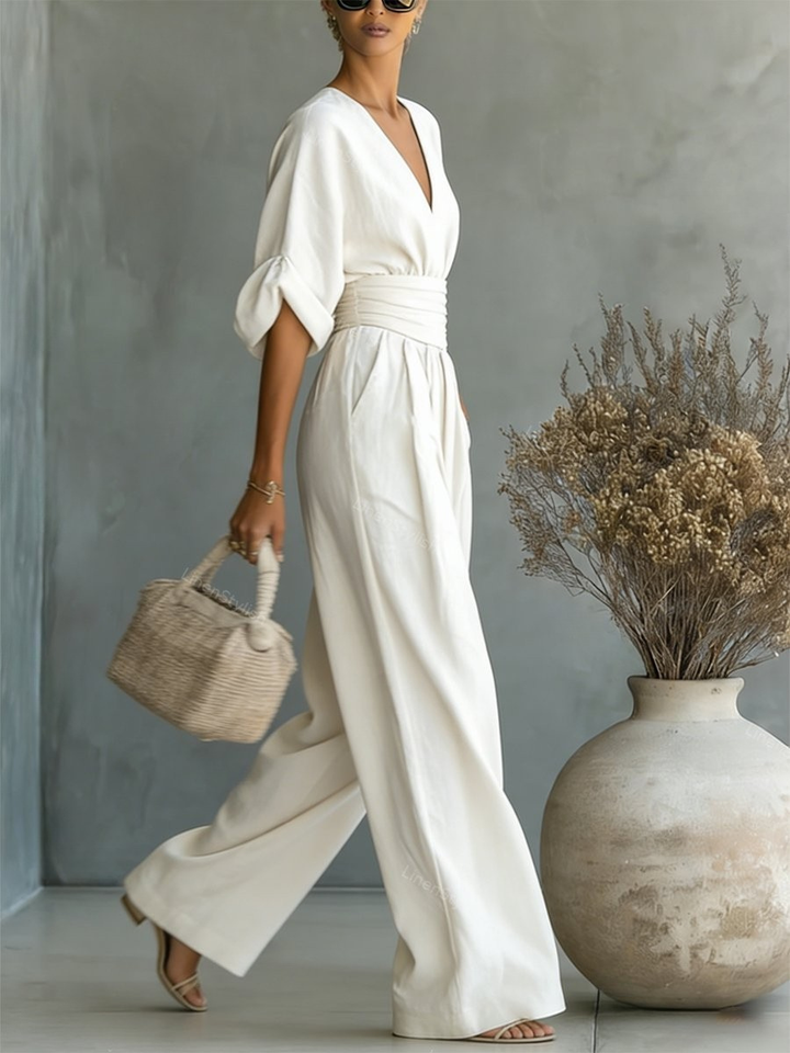 Comfortable women's V-neck jumpsuit, offering all-day wear from office to evening events. Elegant and practical.