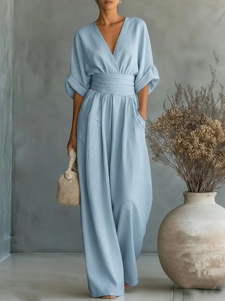 Close-up of elegant V-neck detail on a women's versatile jumpsuit, suitable for day or evening wear.