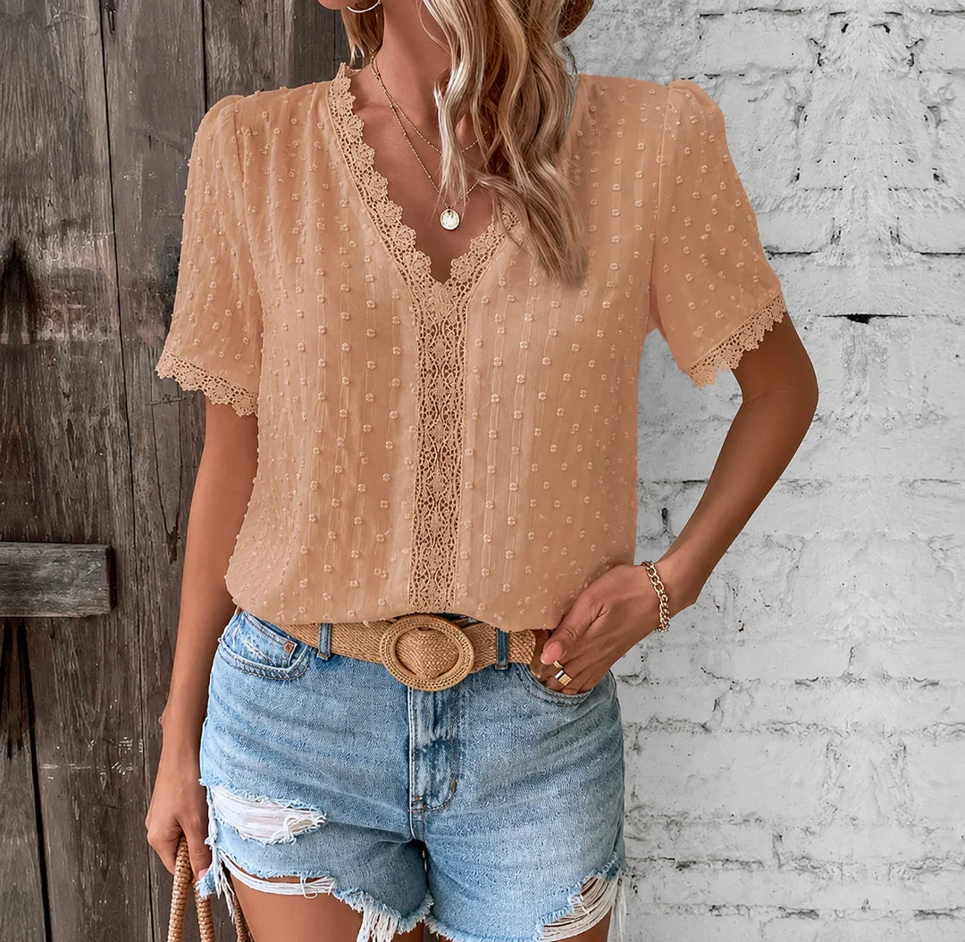 Women's elegant V-neck lace blouse with Swiss dot fabric and short sleeves, perfect for spring casual wear.