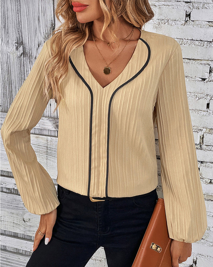 Comfortable women's casual V-neck long sleeve top, elegant balloon sleeves. Everyday chic and versatile fashion.
