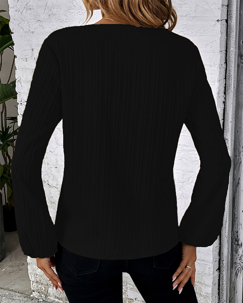 Chic women's V-neck long sleeve top with balloon sleeves. Elegant for office; stylish for casual occasions.