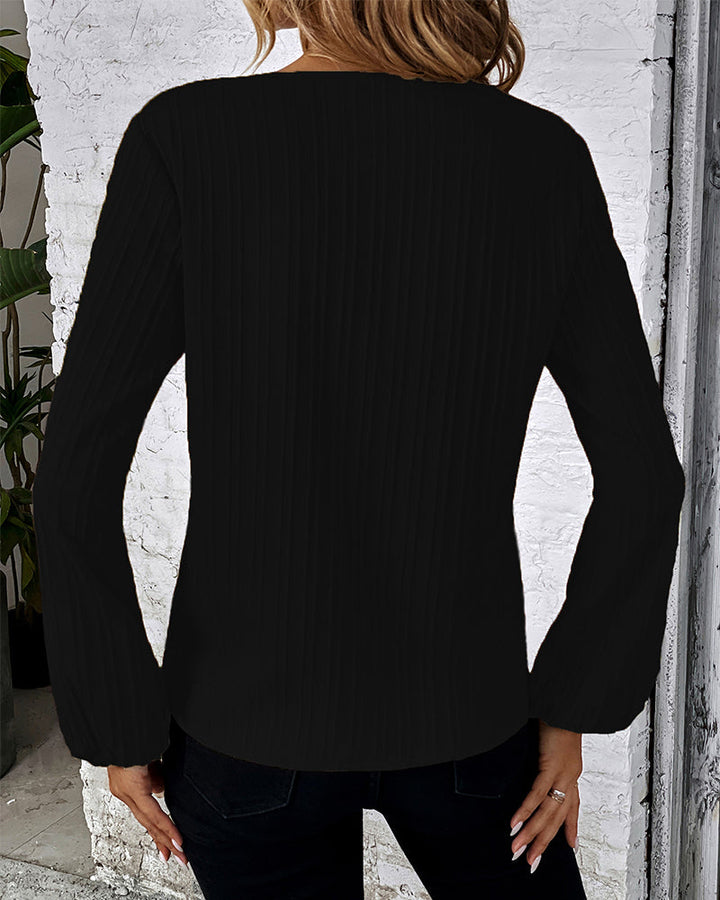 Chic women's V-neck long sleeve top with balloon sleeves. Elegant for office; stylish for casual occasions.