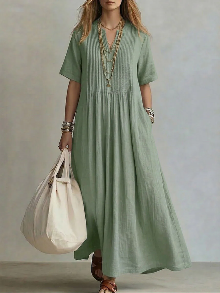 Flowy women's casual V-neck dress with mid-sleeves, ideal for comfortable summer elegance.