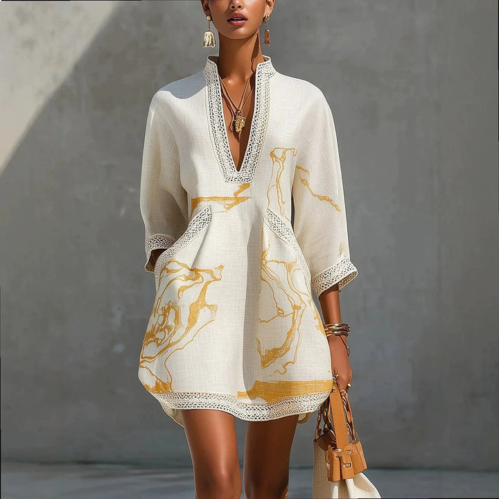 Women's elegant V-neck mini dress with delicate trim, perfect for evening wear or special occasions.