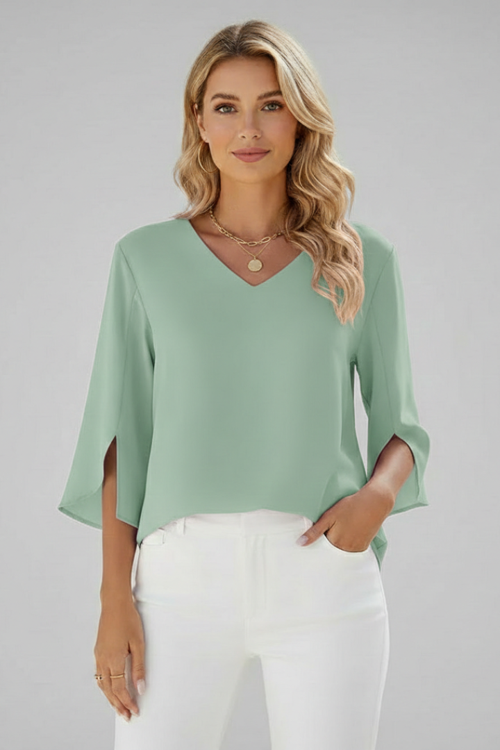 Detailed view of a women's elegant V-neck short sleeve blouse, highlighting the loose fit and fabric.