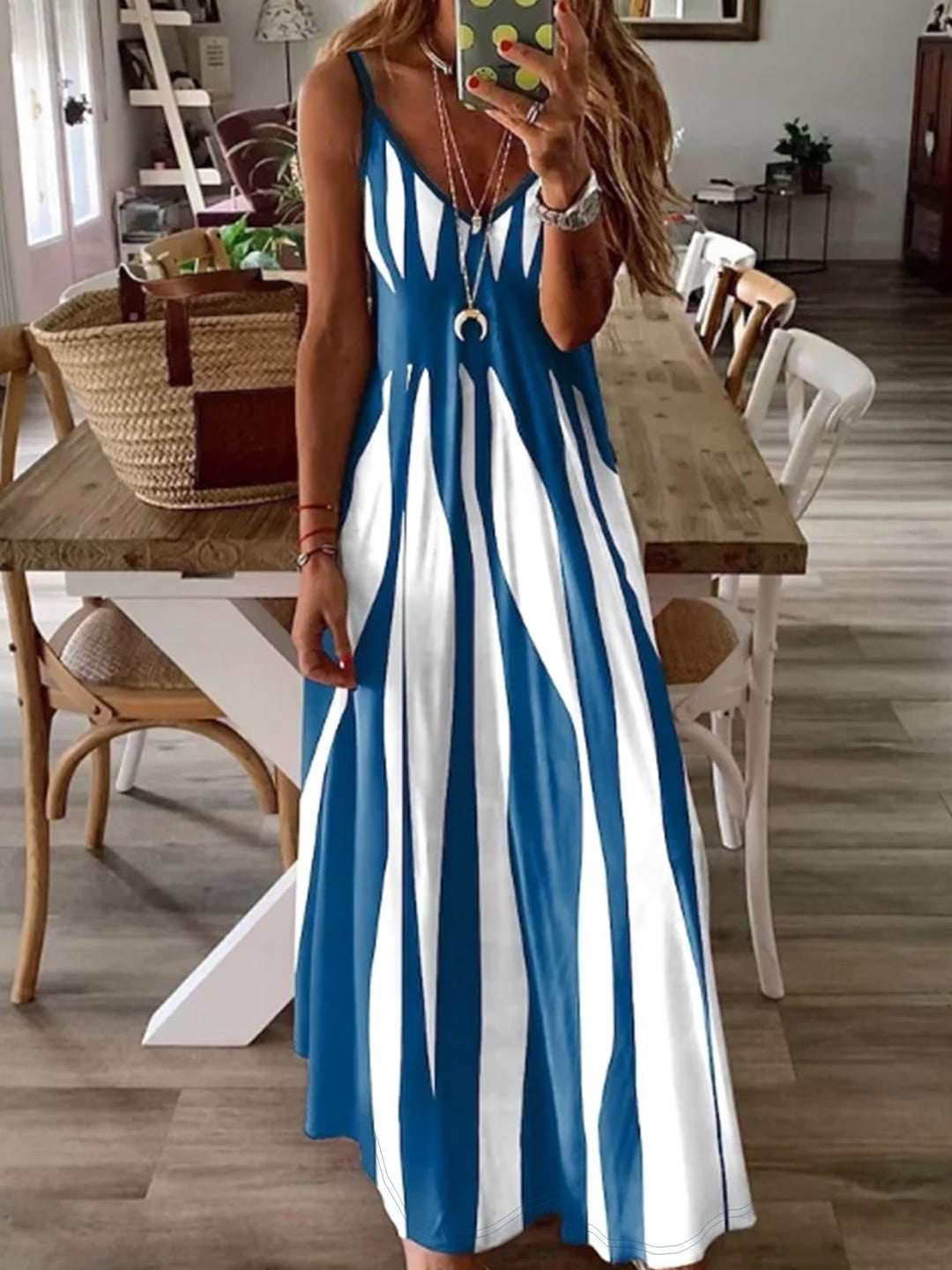 Comfortable women's thin strap V-neck summer dress, perfect for casual wear or elegant occasions. Sleeveless, flowing.