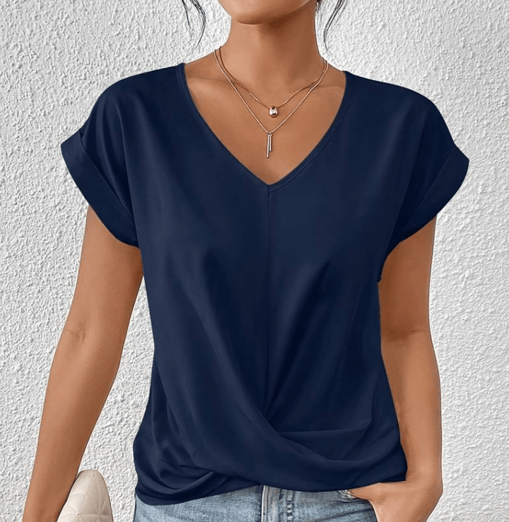 Comfortable women's twist front V-neck blouse, a versatile short sleeve top for casual or elegant occasions.