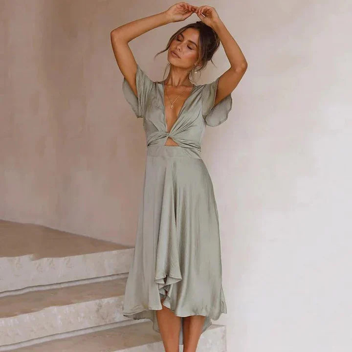 Elegant women's midi dress with flowing vintage style. Comfortable summer fashion, suitable for formal or casual wear.