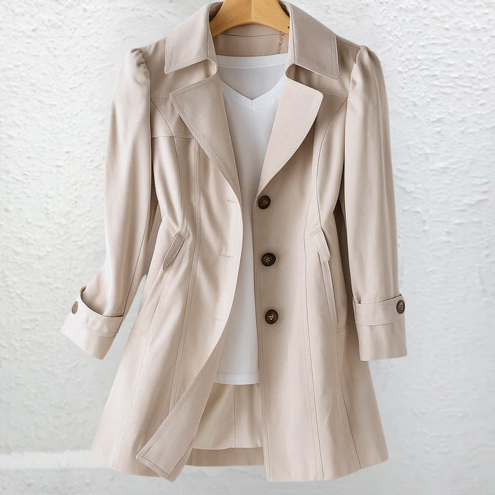Elegant women's vintage trench coat with a belted waist, classic style, knee-length.