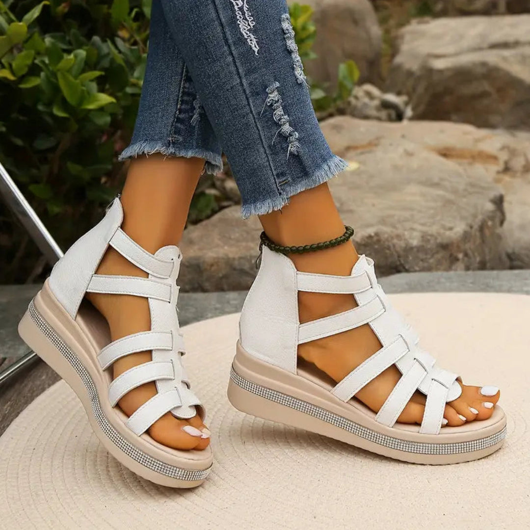 Stylish women's wedge sandals with glittering rhinestones, offering a comfortable and elegant fit.