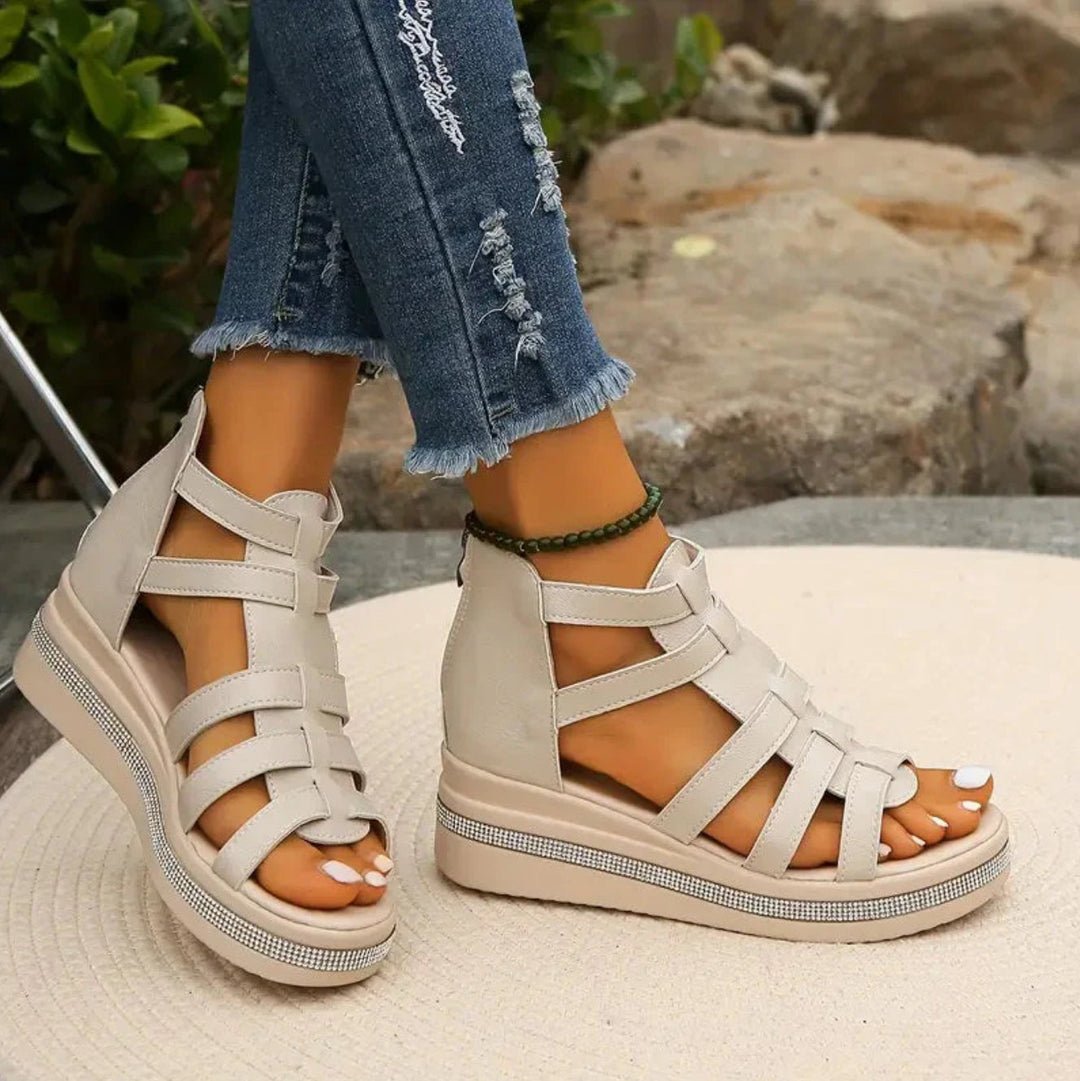 Elegant women's strappy wedge sandals, adorned with sparkling rhinestones for a glamorous look.