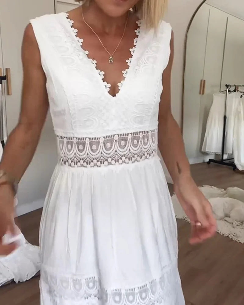 Flowy white boho midi dress for women, elegant and sleeveless with a V-neck, ideal for summer parties & casual wear.