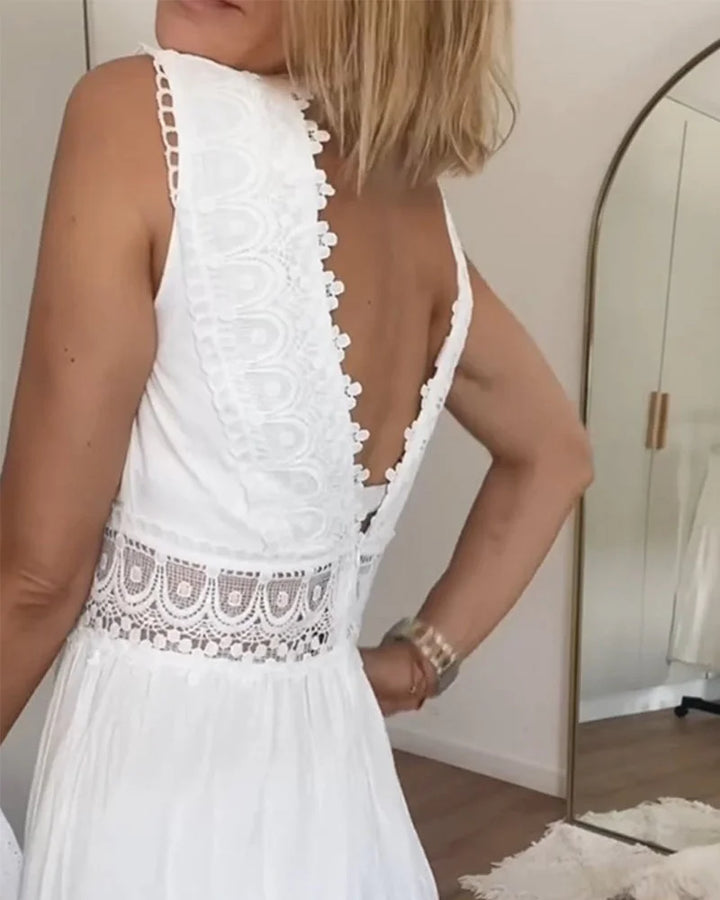 Sleeveless white tiered midi dress for women, elegant boho style with V-neckline and delicate lace accents.