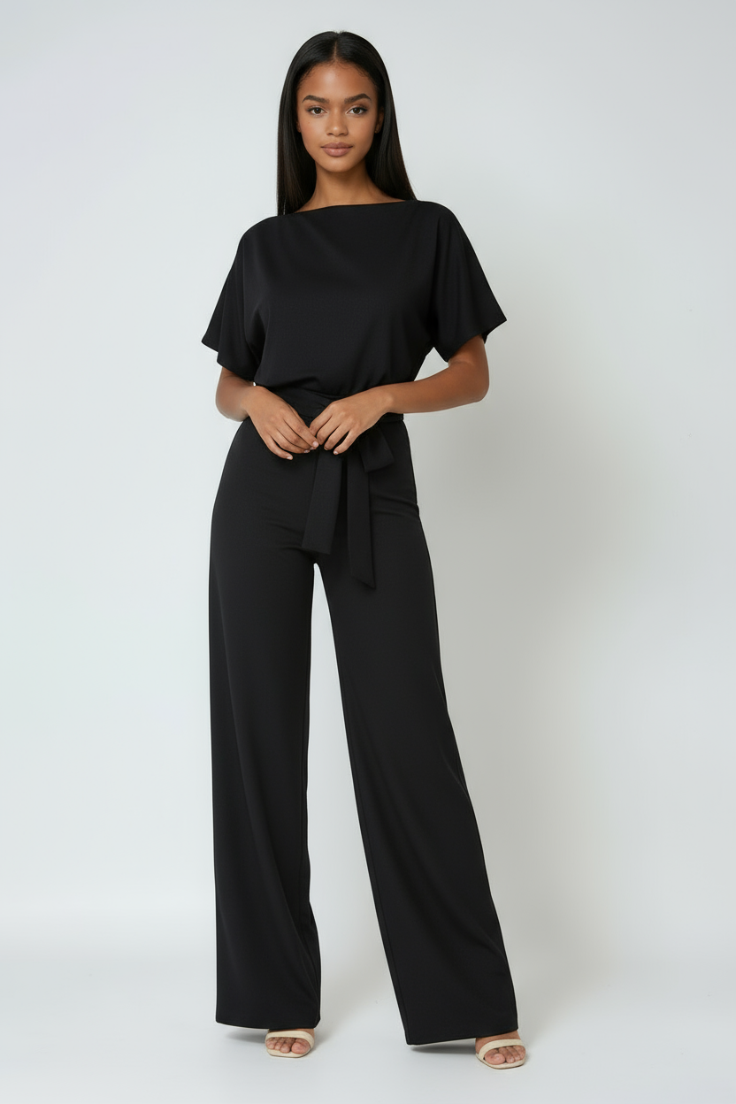 Modern full-length wide-leg jumpsuit for women. Features an elegant waist tie, ideal for versatile summer fashion.