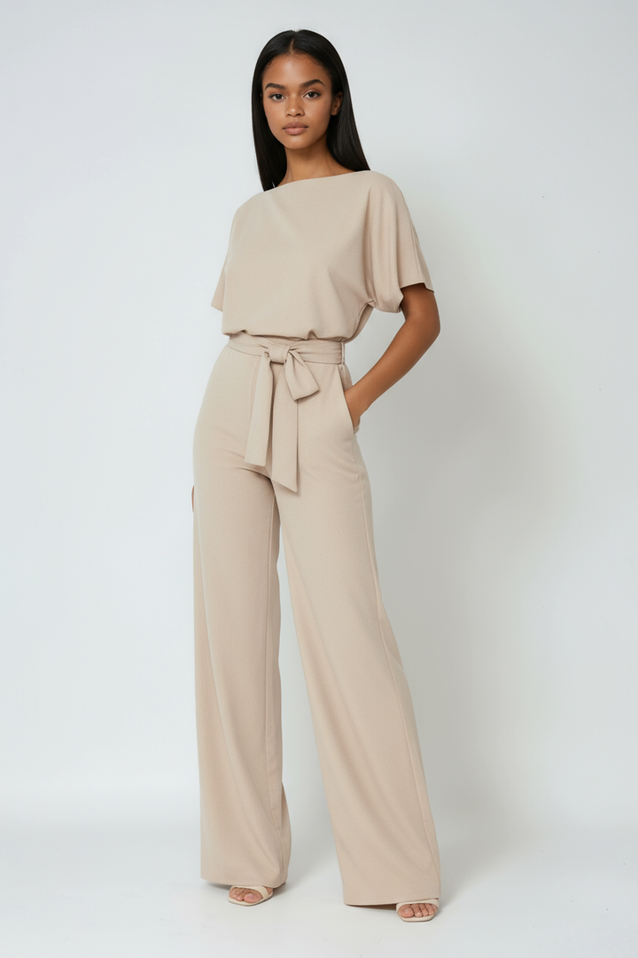 Effortlessly stylish women's wide-leg jumpsuit. Designed for comfortable wear with a flattering tie waist, perfect for spring.