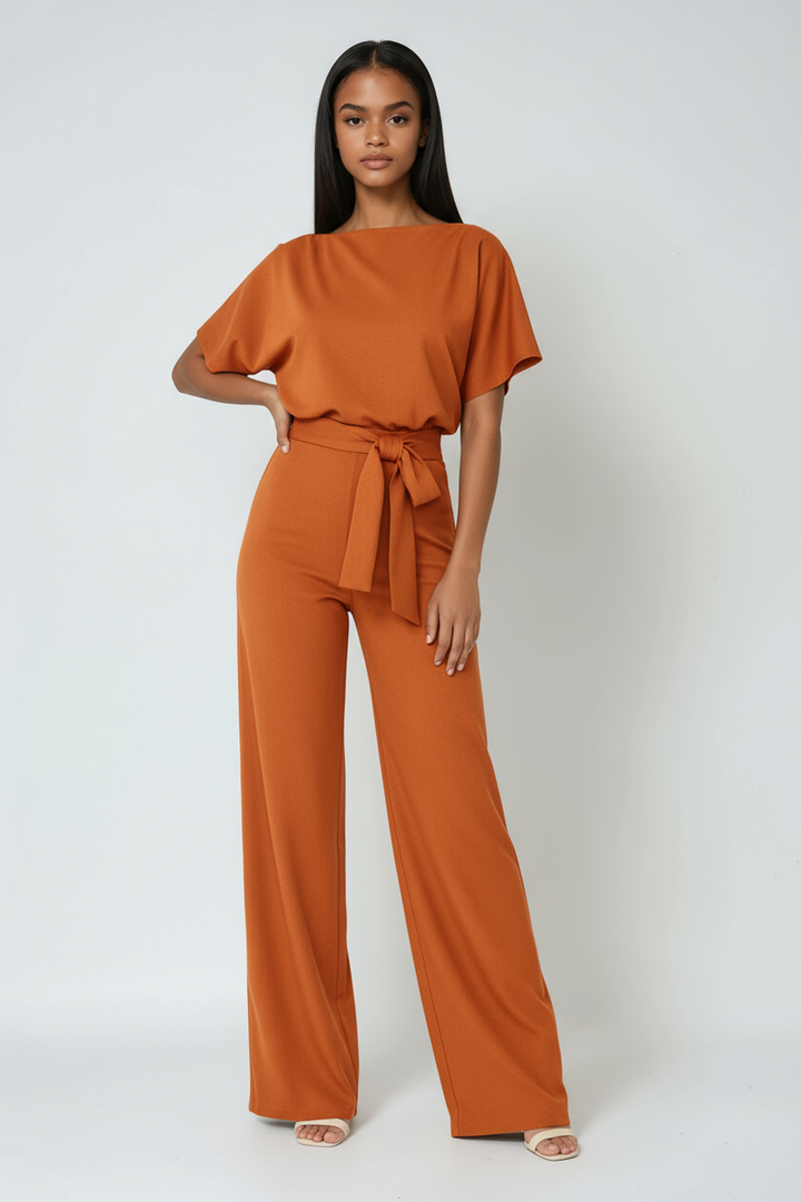 Elegant women's full-length wide-leg jumpsuit featuring a chic tie waist. A comfortable and versatile modern design.