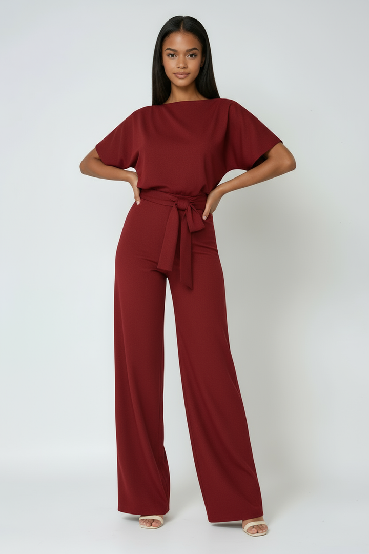 Women's wide-leg jumpsuit with a flattering tie waist for comfortable, elegant spring and summer fashion.