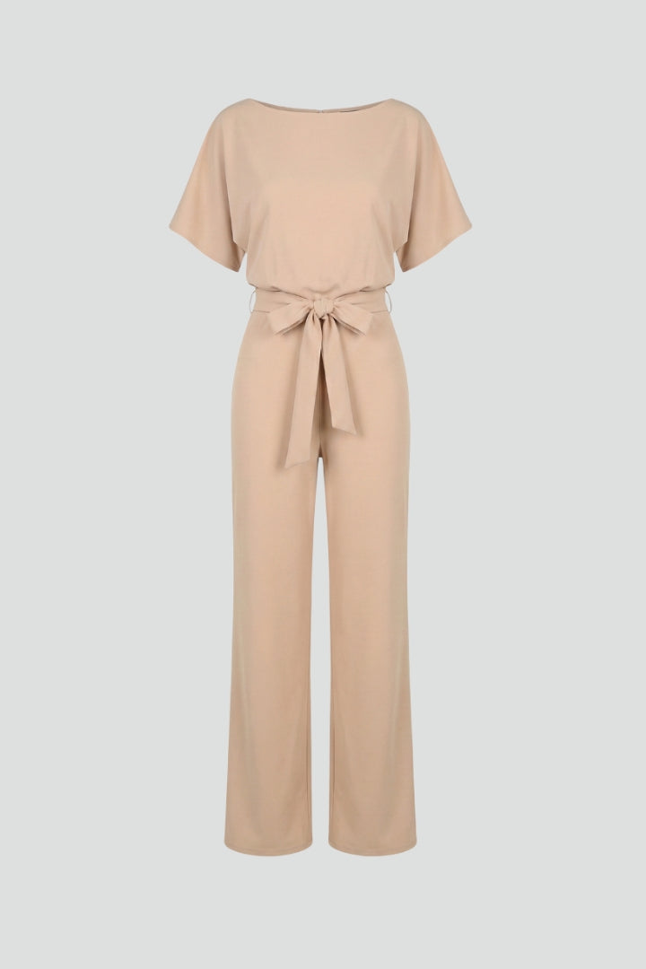 Women's elegant wide-leg jumpsuit with belted waist, perfect for spring & summer fashion.