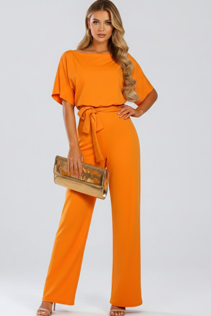 Comfortable & stylish women's wide-leg jumpsuit, a chic one-piece with short sleeves & belted waist.