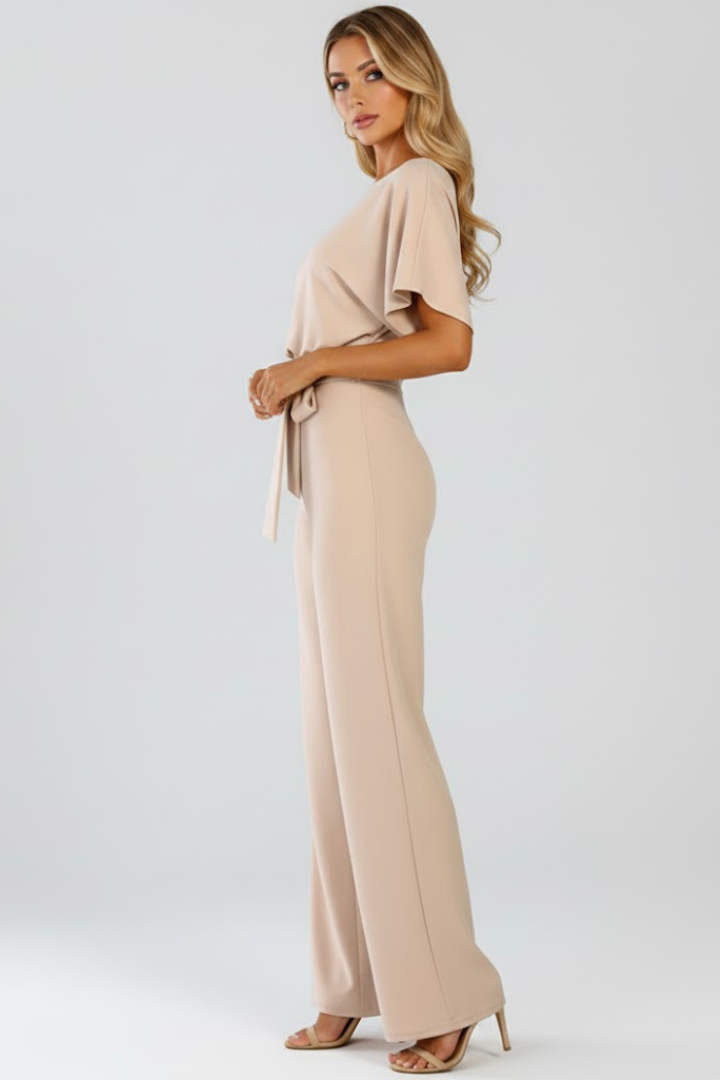 Fashionable women's wide-leg jumpsuit with a flattering belted waist and short sleeves.