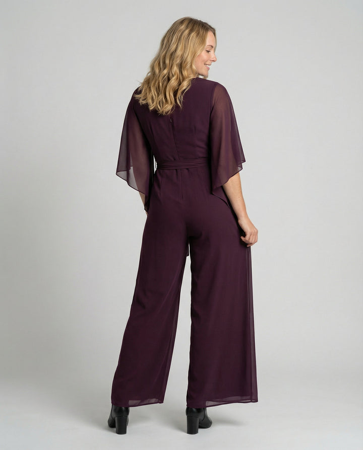 Chic women's jumpsuit featuring a flattering wide-leg design and cascading neckline.