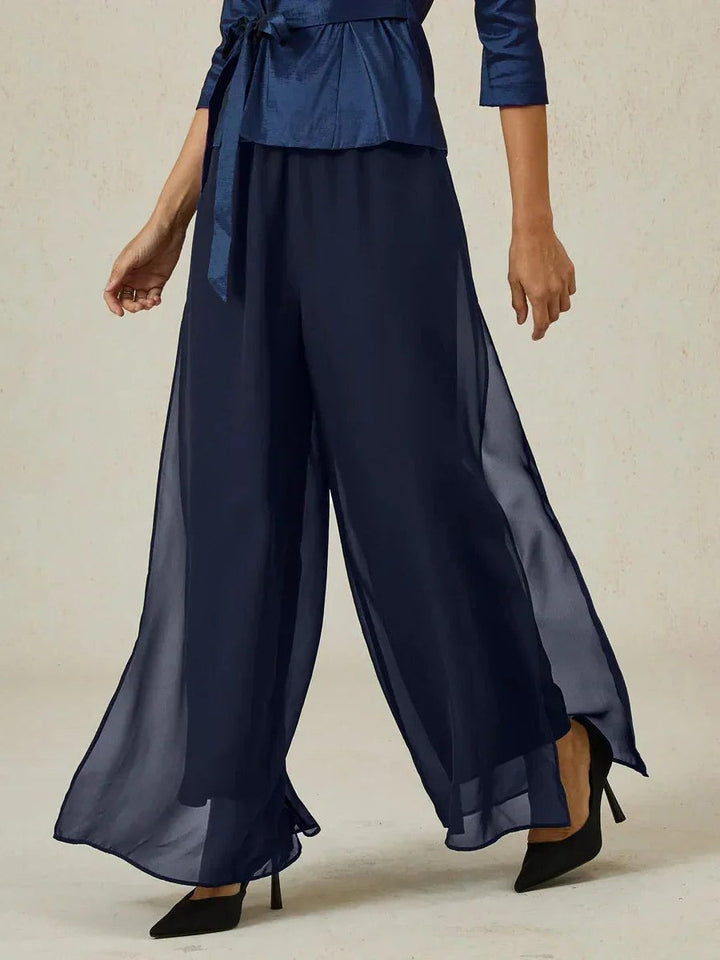 Women's elegant wide leg overlay trousers with flowy fabric and comfortable fit.