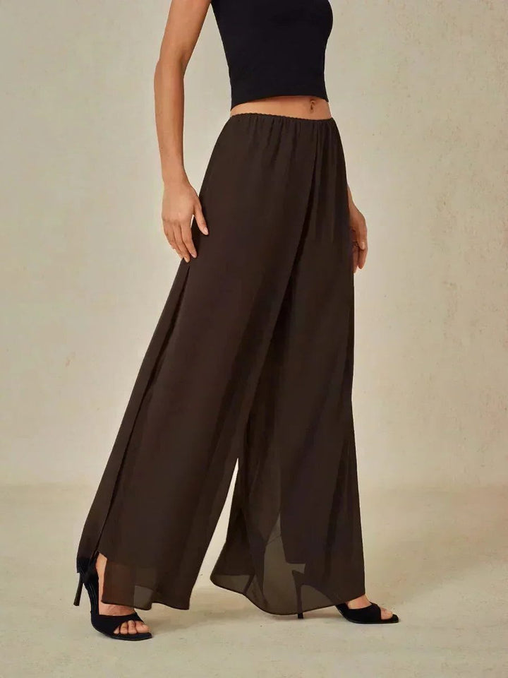 Women's wide leg pants with a comfortable tie waist and sophisticated overlay.