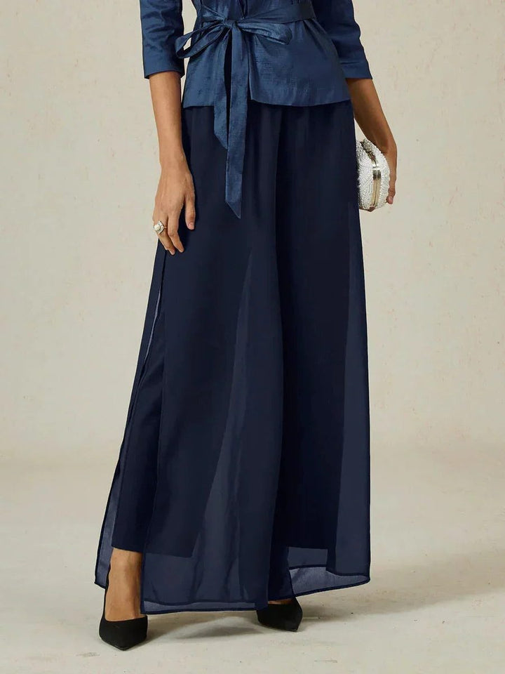 Fashionable women's wide leg pants, featuring a unique overlay design and tie waist.