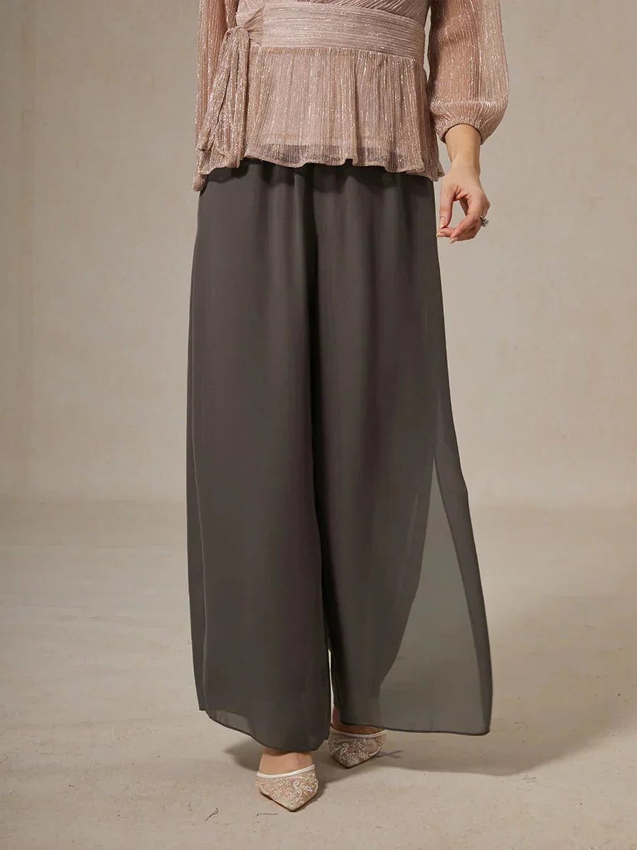 Comfortable women's wide leg pants with an elegant tie waist and flowy fabric.