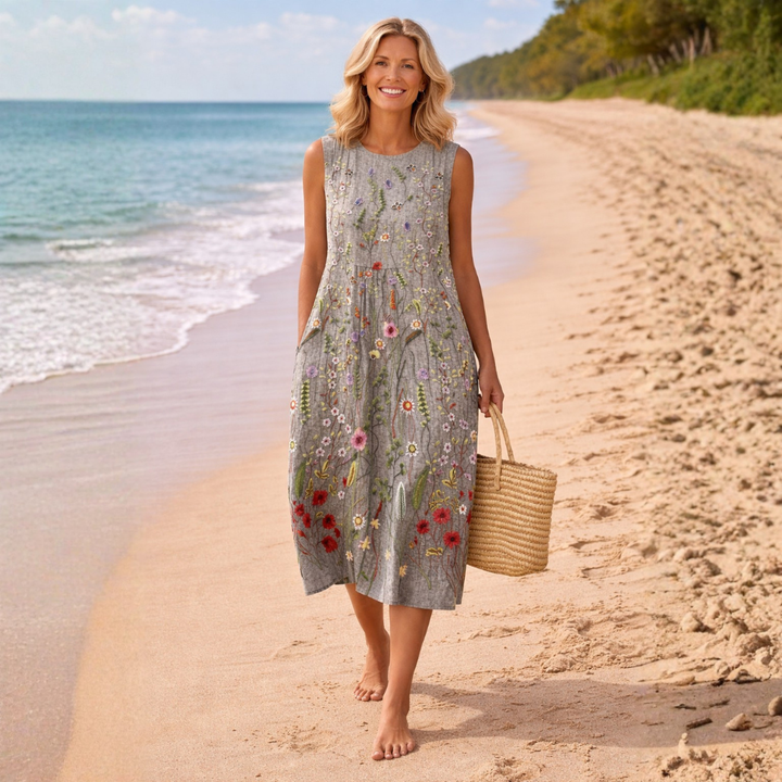 Stylish women's floral midi dress with a comfortable relaxed fit. Perfect casual chic sleeveless outfit for summer.