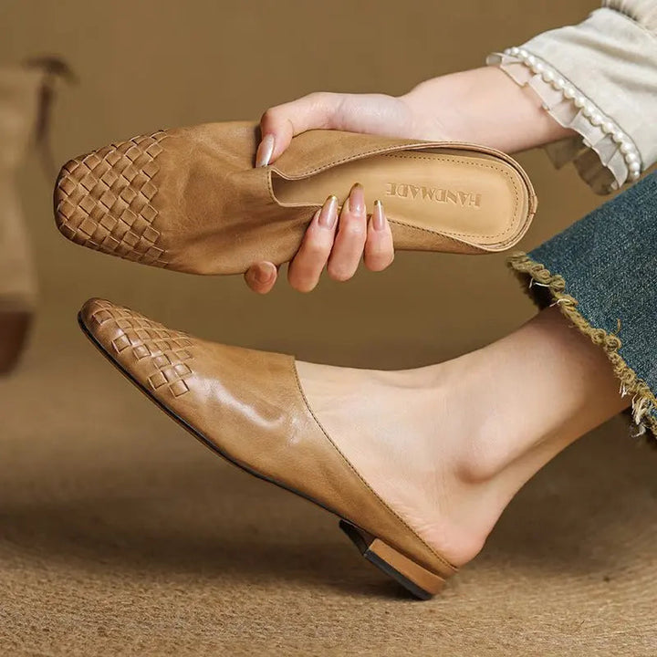Women's elegant woven square toe mules, comfortable low heel design.