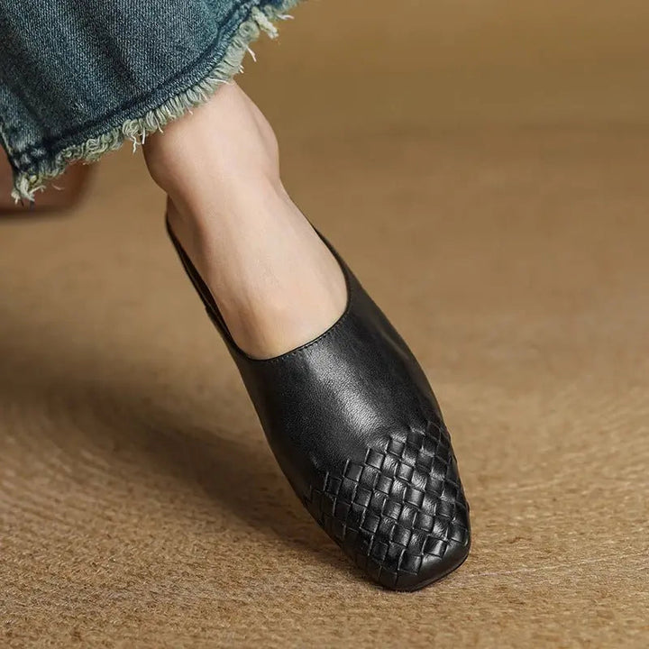 Elegant spring/summer woven mules for women, featuring a distinct square toe and low heel.