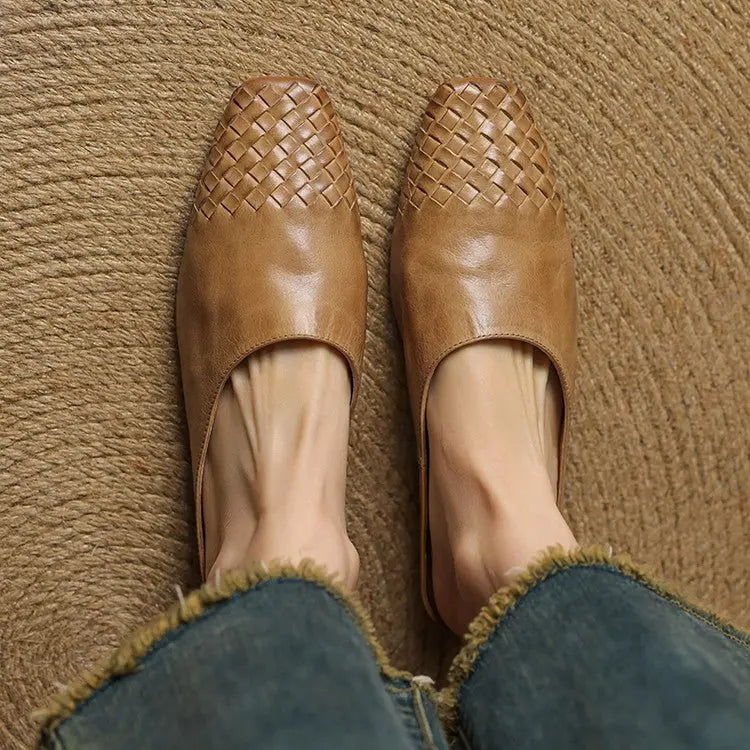 Versatile women's footwear: woven low heel mules with a modern square toe.