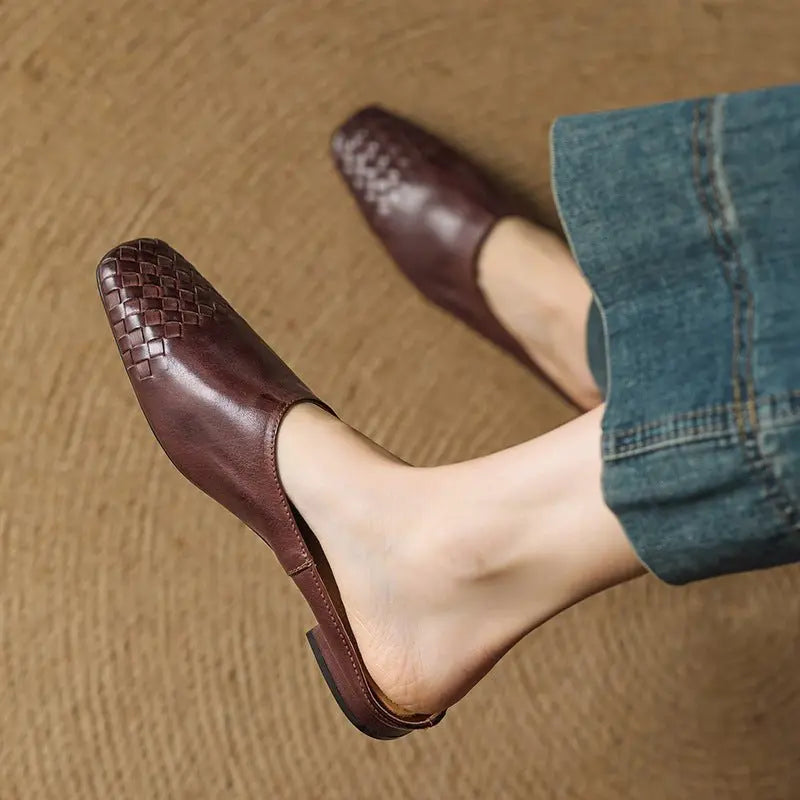 Sophisticated women's woven mules with a contemporary square toe and low block heel.