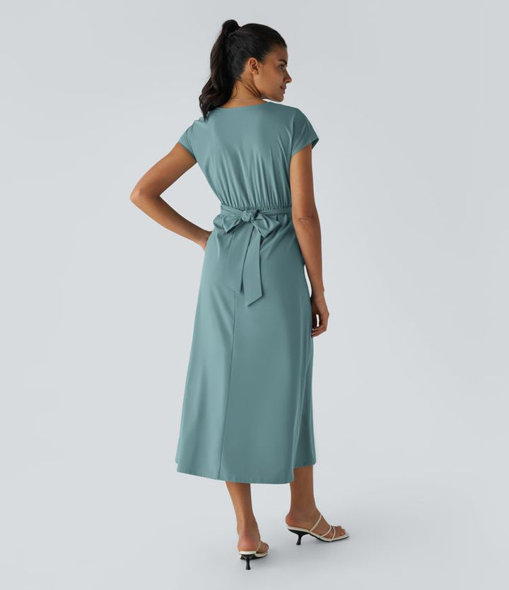 Sophisticated women's wrap midi dress. V-neck, short sleeves, high waist. Ideal for elegant and casual wear.