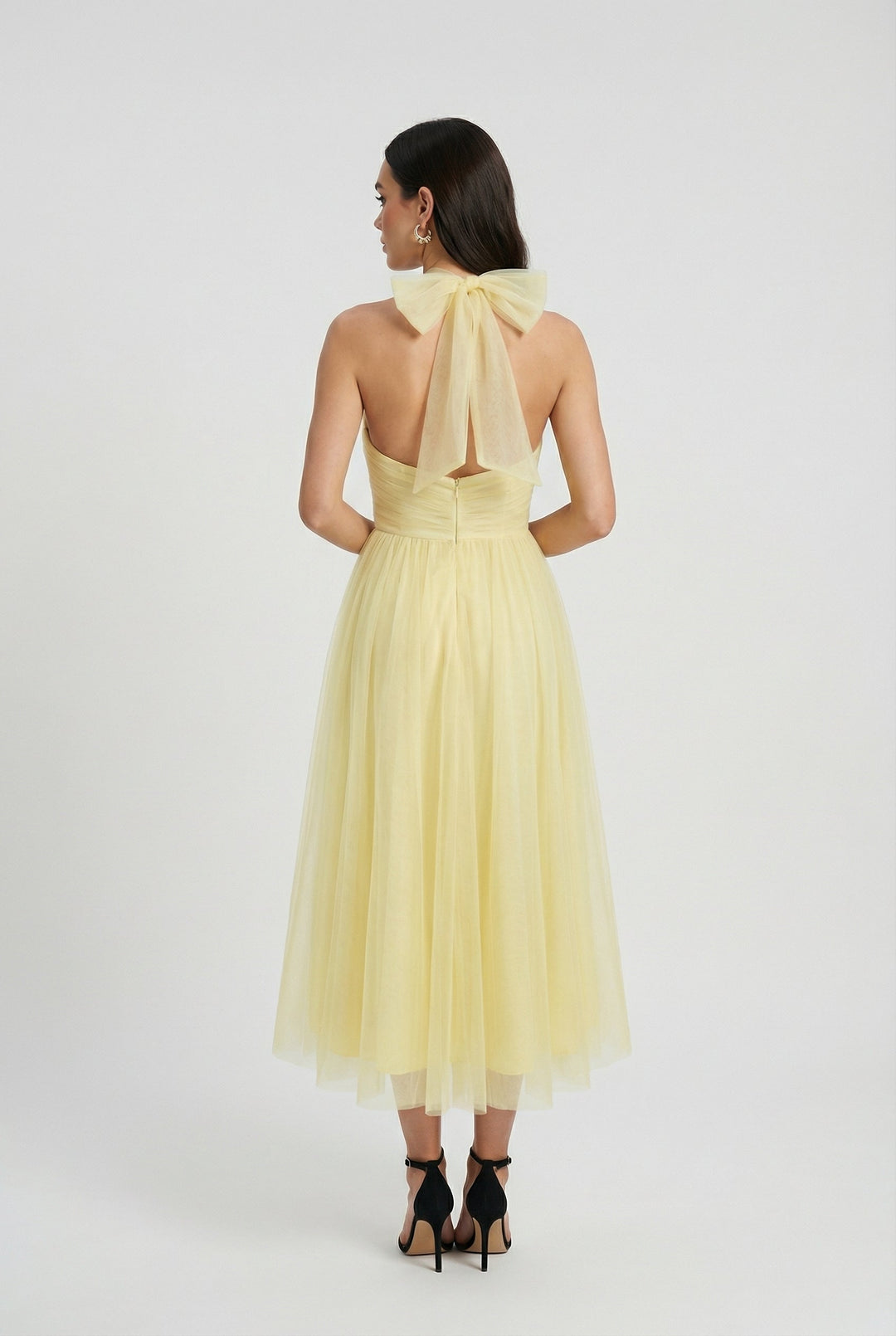Comfortable and stylish yellow midi dress with a flattering high neckline for women.