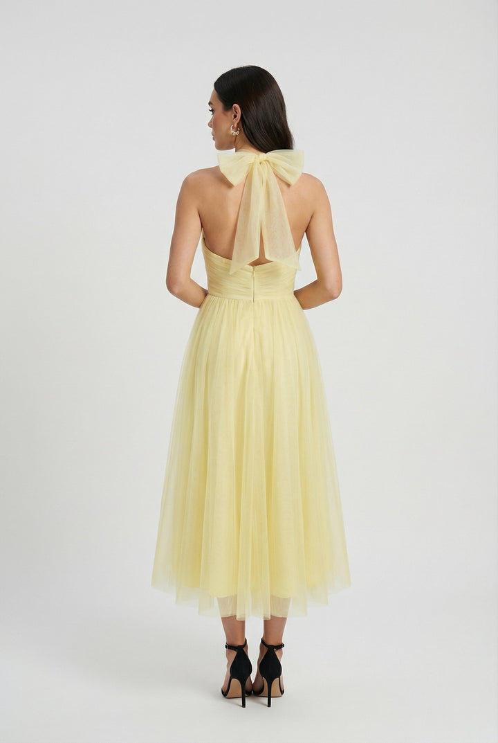 Comfortable and stylish yellow midi dress with a flattering high neckline for women.